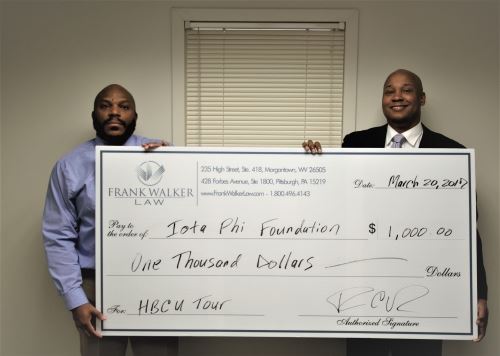 Attorney Frank Walker Presents the Donation Check to his Omega Psi Phi Fraternity Brother Michael Harrell for the HBCU College Tour